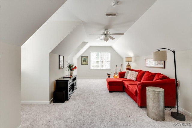 living room featuring carpet, visible vents, lofted ceiling, and baseboards