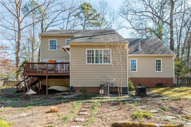 back of property featuring a deck, central AC unit, stairway, and fence