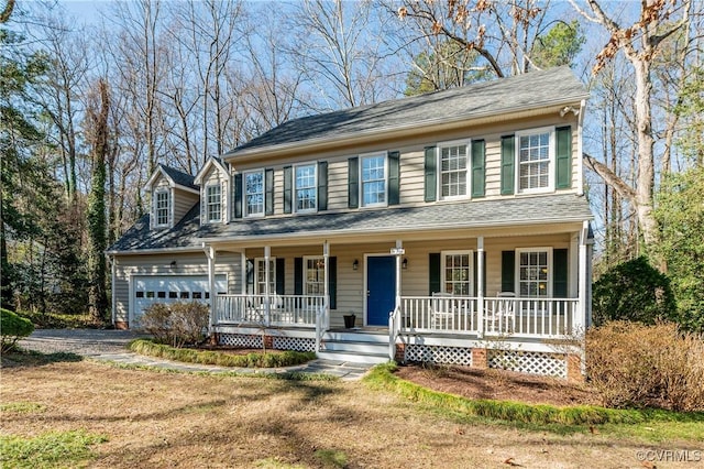 colonial house with a porch, roof with shingles, and a garage