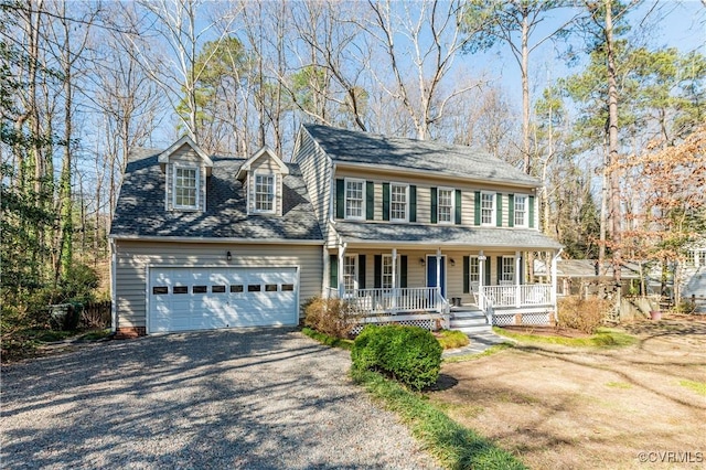 view of front of property with a porch, gravel driveway, roof with shingles, and an attached garage