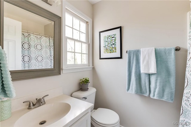 bathroom with toilet and vanity