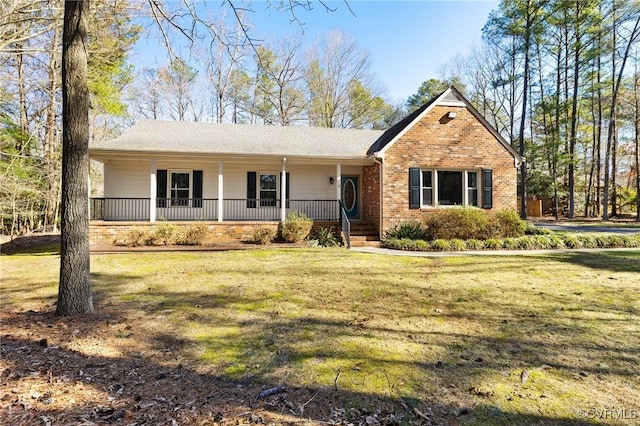 ranch-style house featuring a front yard, a porch, and brick siding