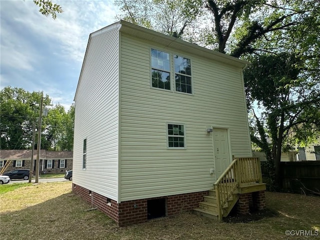 rear view of house featuring crawl space