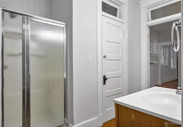 bathroom featuring a stall shower and vanity