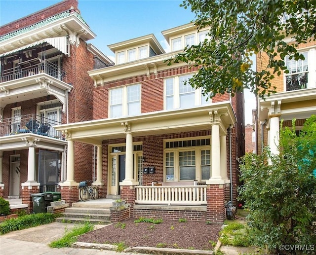 view of front of property with a porch and brick siding