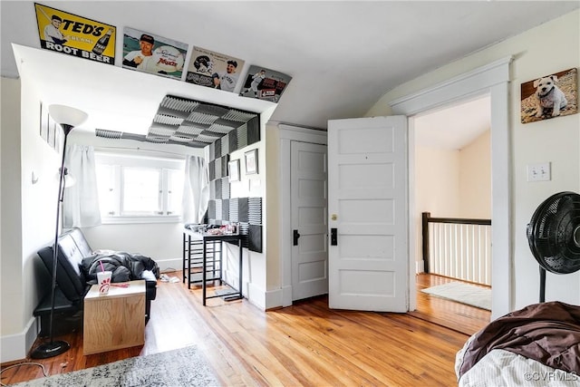 interior space featuring light wood-style flooring and baseboards