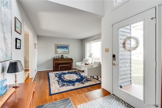 entryway with wood finished floors