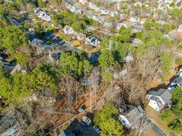 birds eye view of property with a residential view