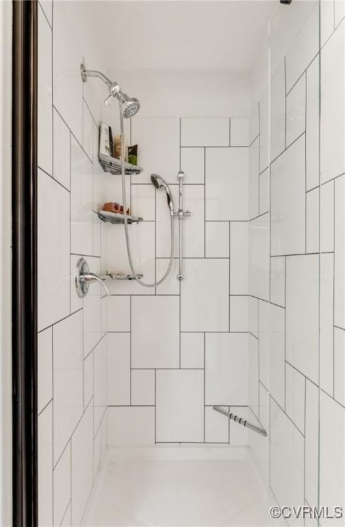 interior details with a package area and tiled shower