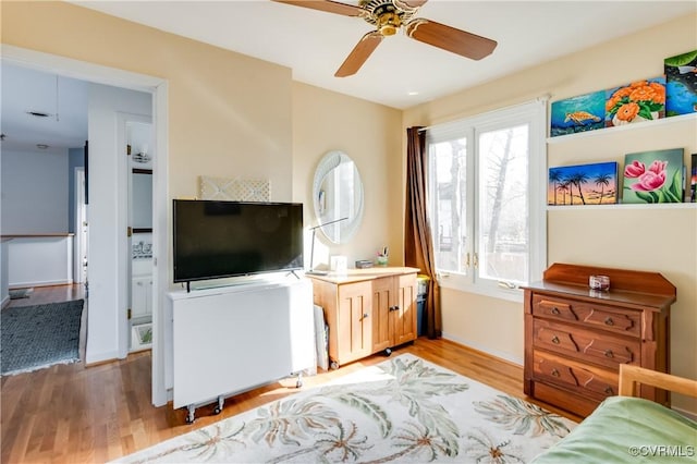 interior space with light wood-style floors and a ceiling fan