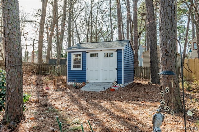 view of shed with a fenced backyard