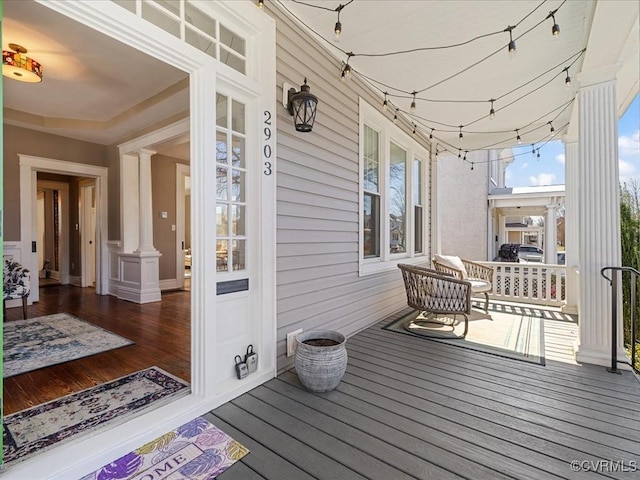 wooden deck featuring covered porch