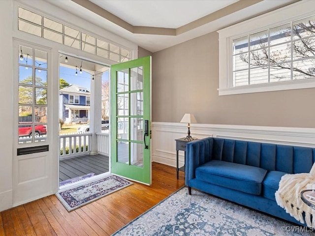 interior space featuring a wainscoted wall and hardwood / wood-style flooring