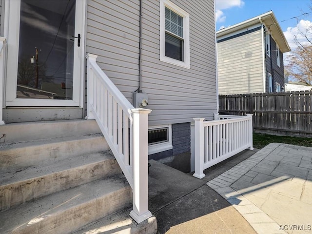 exterior space featuring a patio area and fence