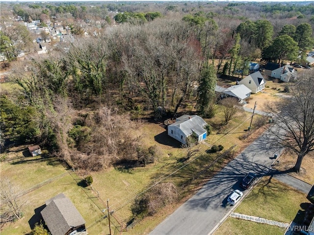 drone / aerial view featuring a forest view