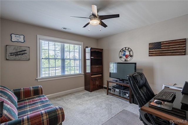 office featuring a ceiling fan, carpet flooring, visible vents, and baseboards