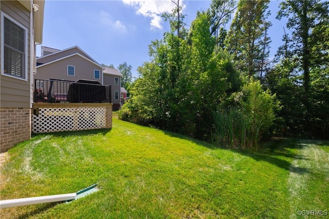 view of yard with a wooden deck