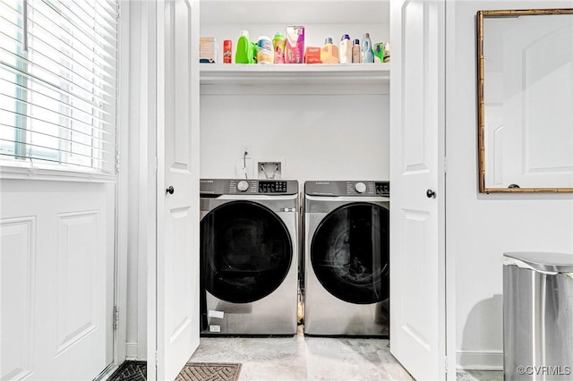 laundry area featuring washer and clothes dryer and laundry area