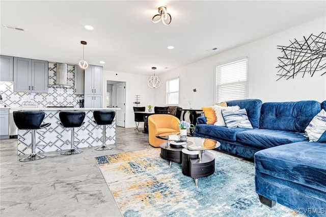 living room with recessed lighting and visible vents