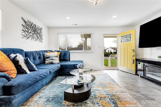 living area featuring recessed lighting and visible vents