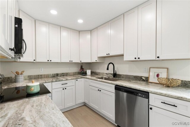 kitchen featuring range, white cabinetry, dishwasher, and a sink