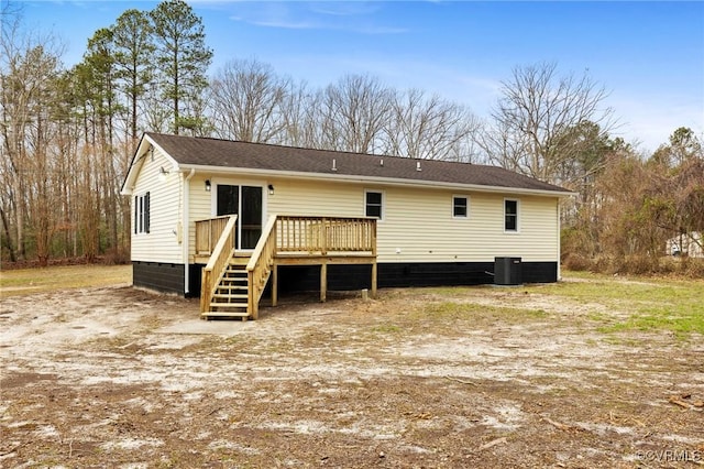 back of house with crawl space, a deck, and cooling unit