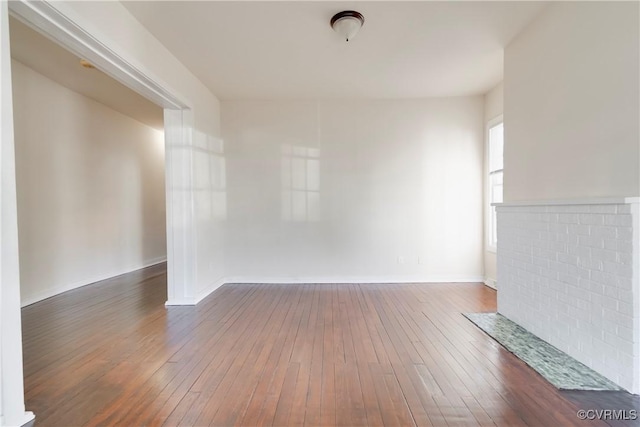 spare room with dark wood-style flooring