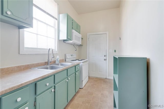 kitchen featuring light countertops, white appliances, a sink, and green cabinetry