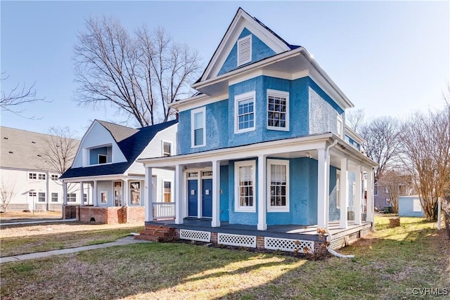 view of front of house featuring a front lawn and a porch