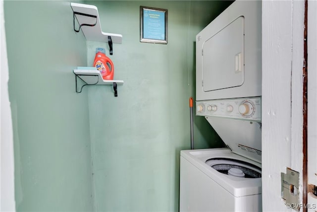 washroom with laundry area and stacked washer / dryer