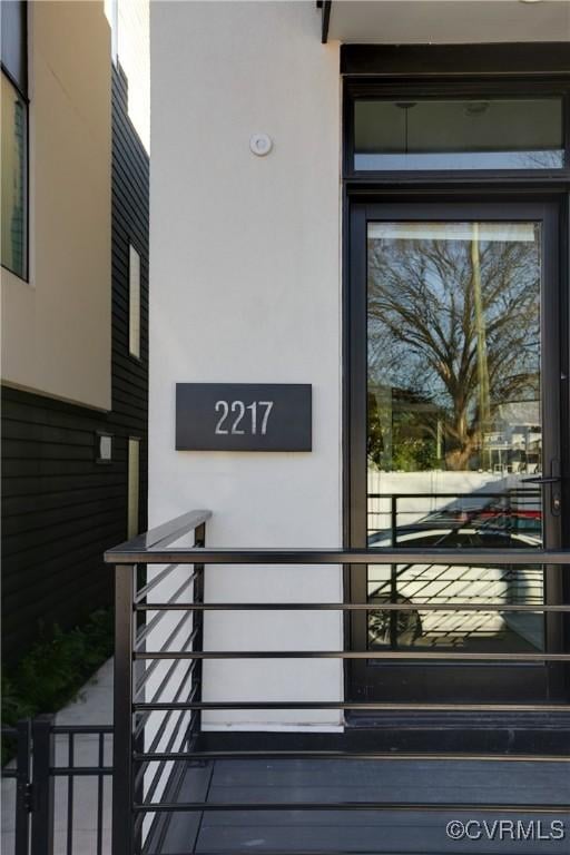 property entrance featuring stucco siding