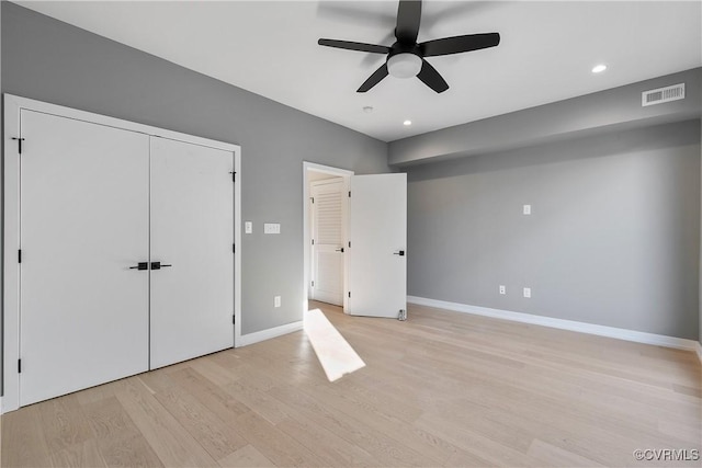 unfurnished bedroom featuring light wood-type flooring, visible vents, baseboards, and recessed lighting