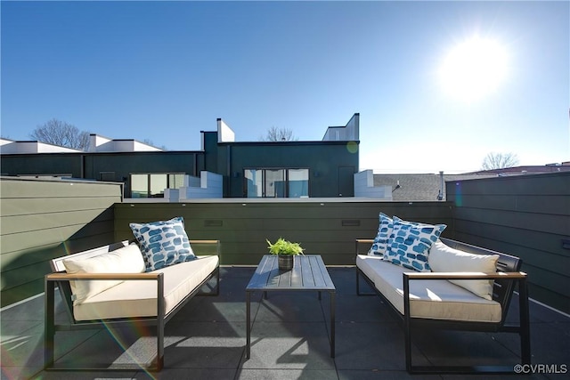 view of patio featuring fence and outdoor lounge area