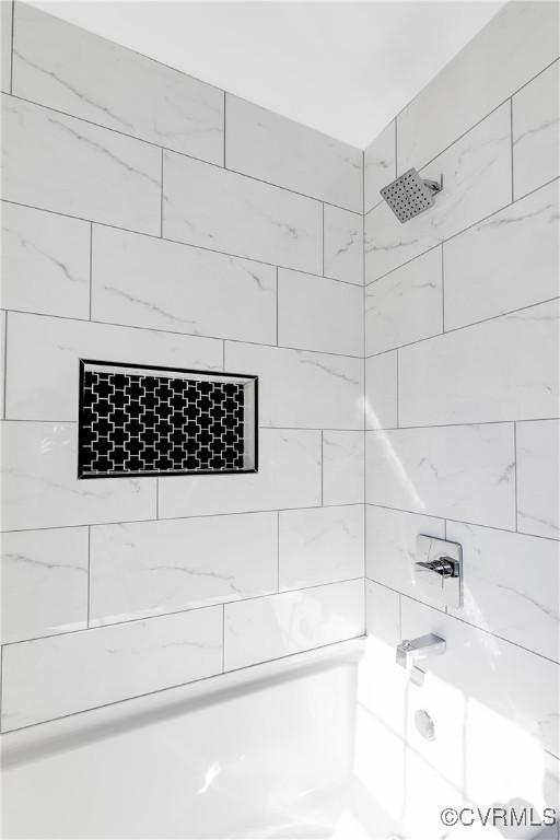 bathroom featuring  shower combination