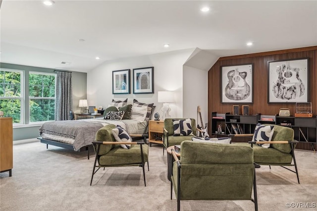 carpeted bedroom featuring lofted ceiling, recessed lighting, and wooden walls