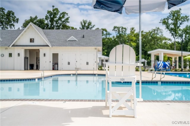 community pool with a patio