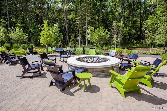 view of patio / terrace featuring an outdoor fire pit