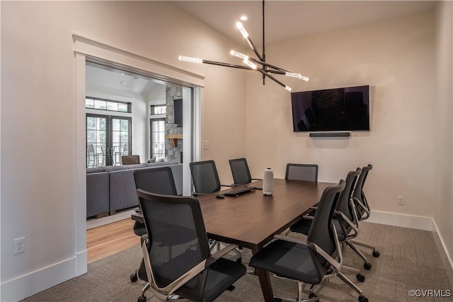 office with a chandelier, carpet, french doors, and baseboards