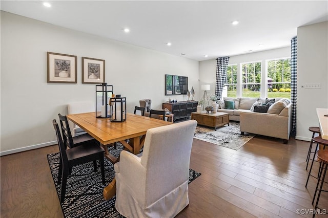 dining area featuring recessed lighting, dark wood-style flooring, and baseboards