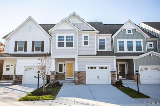 view of front of house featuring a garage, driveway, and board and batten siding