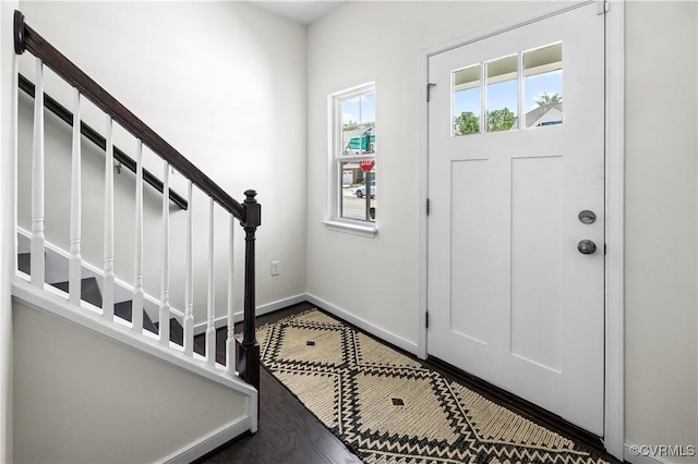 entryway with stairs and baseboards