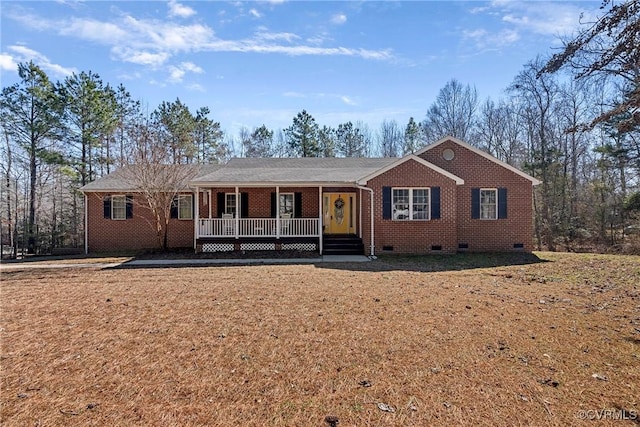 ranch-style home with a porch, crawl space, and brick siding