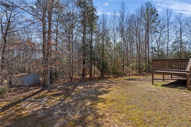 view of yard featuring a deck