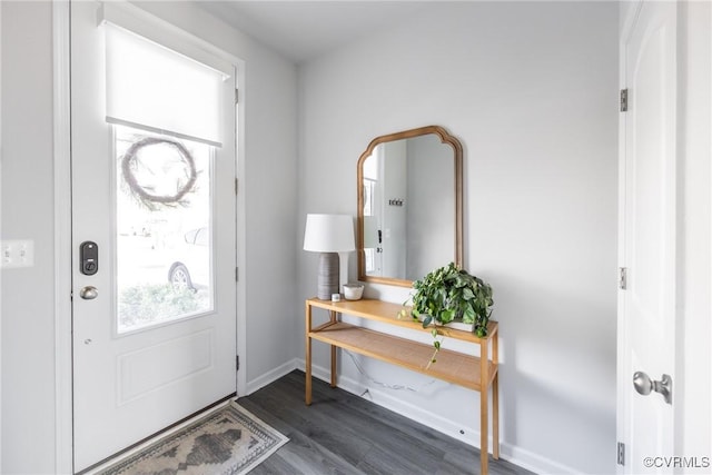 entryway with dark wood-style flooring and baseboards