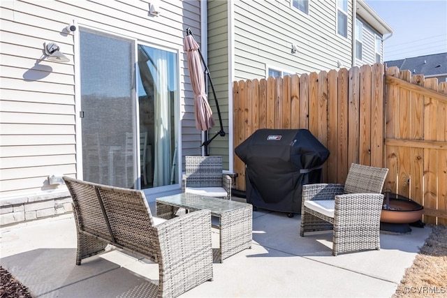 view of patio with fence and grilling area