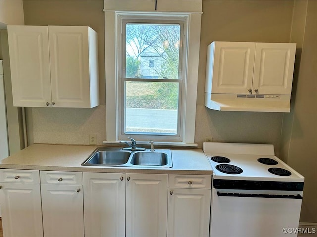 kitchen with under cabinet range hood, a sink, white cabinetry, electric stove, and light countertops