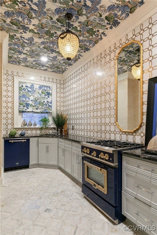 kitchen featuring ornamental molding, a sink, and gas range oven