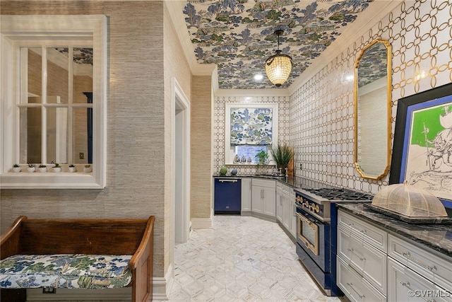 kitchen featuring dishwashing machine, white cabinetry, high end range, wallpapered walls, and crown molding