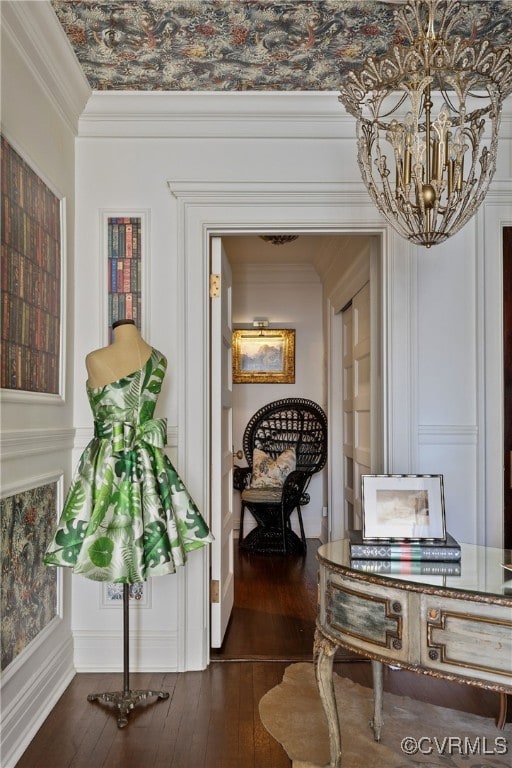 corridor featuring dark wood-style floors and ornamental molding