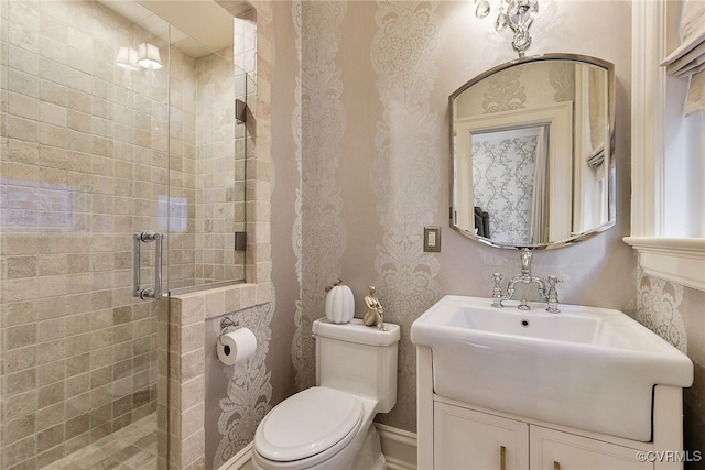 full bath featuring a shower stall, toilet, and vanity